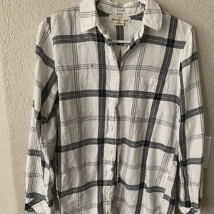 A black and white flannel button up shirt.